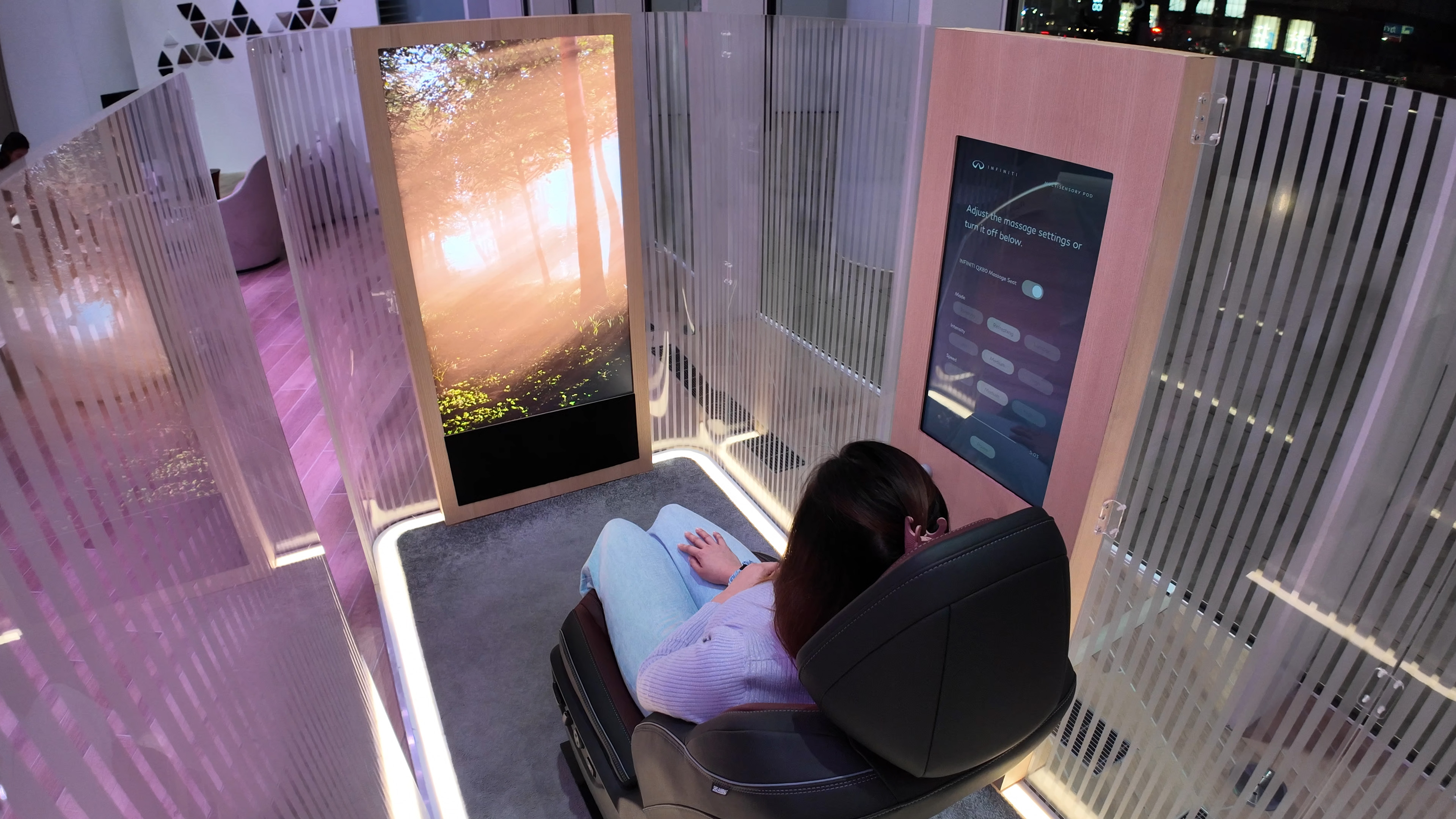 A visitor experiencing the INFINITI MultiSensory Pod